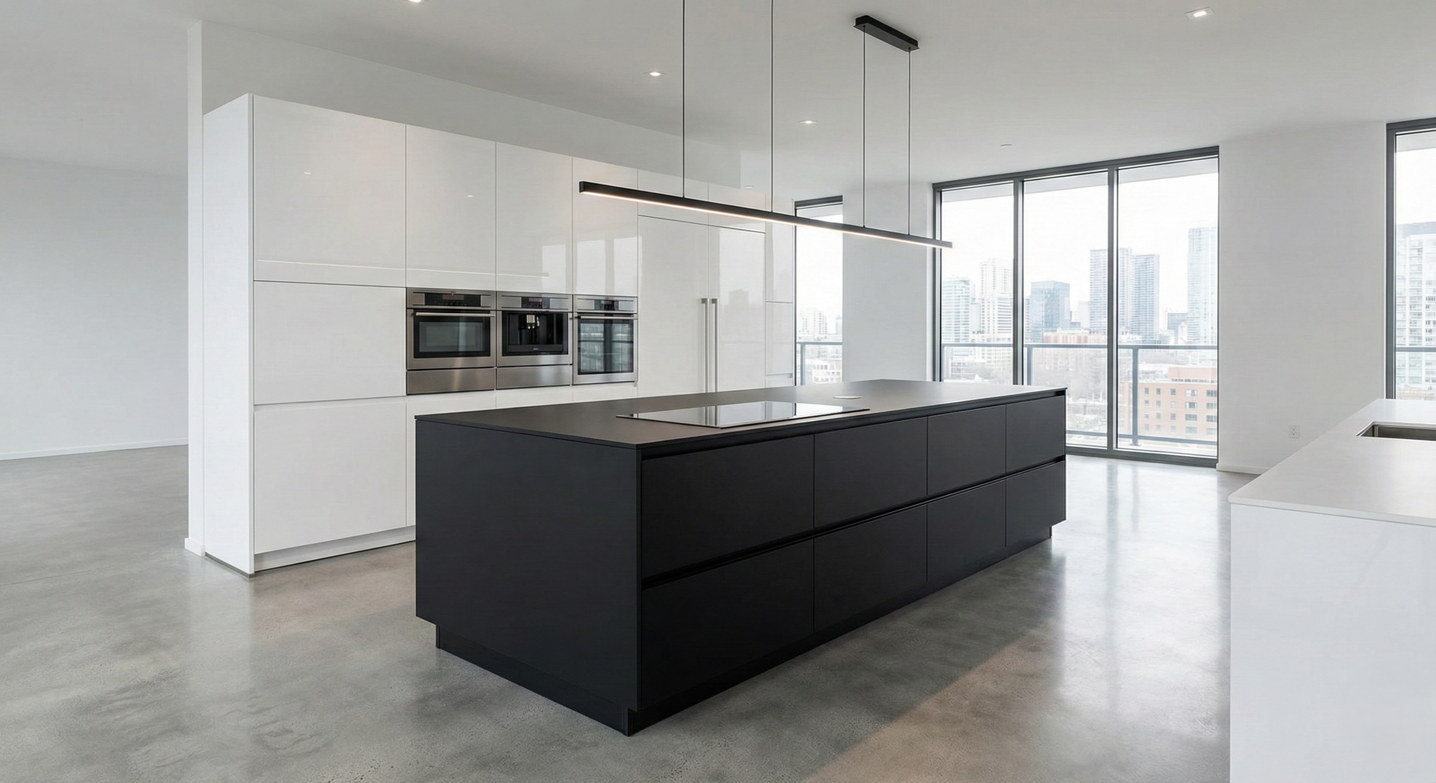 Luxurious island kitchen with marble countertops and modern lighting.